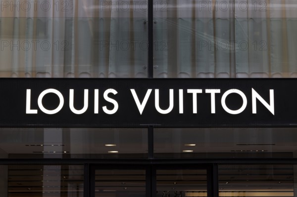 Close-up, logo of the French luxury fashion brand Louis Vuitton on a boutique in the shopping