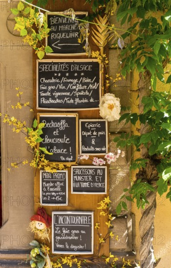 Riquewihr, France - 30 May, 2022: close-up view of many handwritten signs in French language