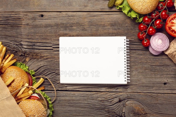 Flat lay burgers with mock up notepad