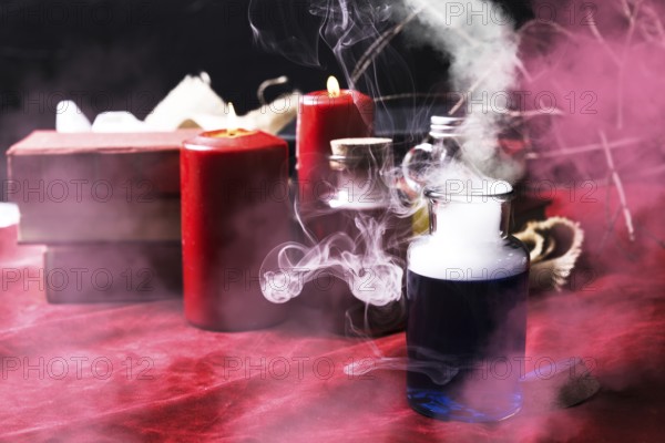 Smoky blue potion with halloween decorations