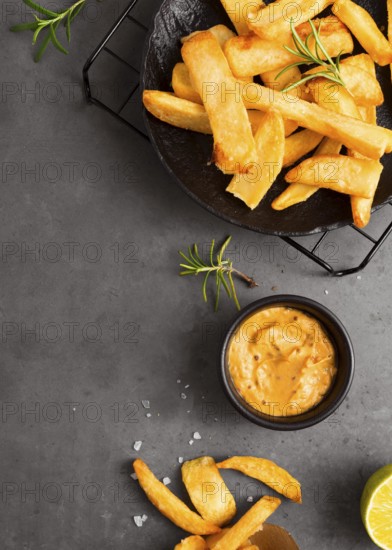 Flat lay french fries cooling rack with mustard