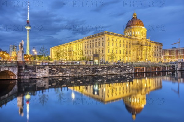 The rebuilt Berlin City Palace and the famous TV Tower by night