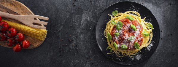 Composition with a plate of spaghetti bolognese