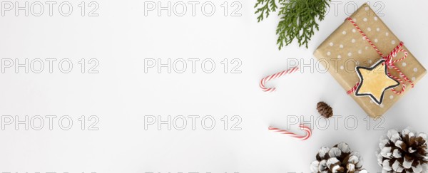 Top view christmas gift with pine cones candy canes