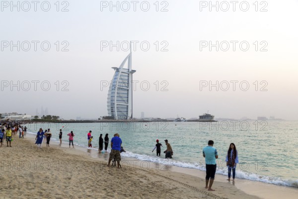 Dubai, UAE, July 20, 2018: Locals and tourists enjoy a Friday evening at Jumeirah Public Beach