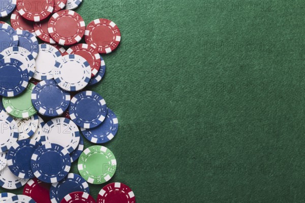 High angle view poker chips green table
