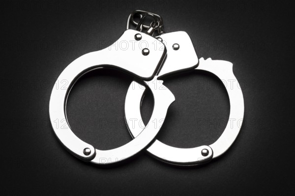 Crime law arrest police steel handcuffs isolated