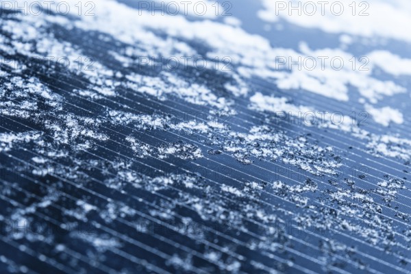 Close-up of frozen ice on a solar cell of a balcony power plant, Düsseldorf, Germany, Europe