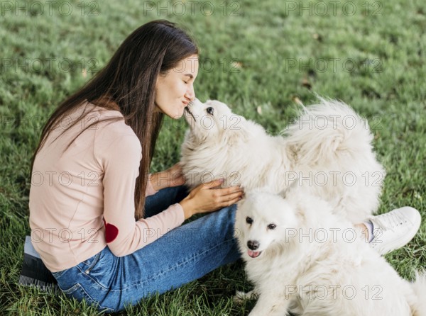 Woman happy play with cute dogs