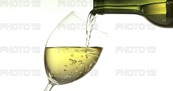 White Wine being poured into Glass, against White Background