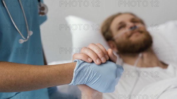 Close up patient health worker holding hands
