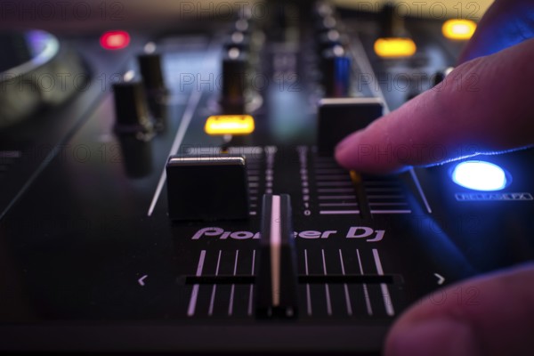 Dj console and hand, bokeh, Pioneer DJ