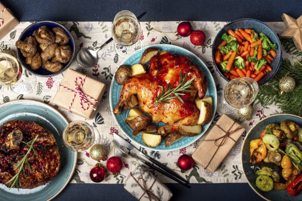 Christmas evening table top view with festive food and sparkling wine glasses, Xmas dinner with