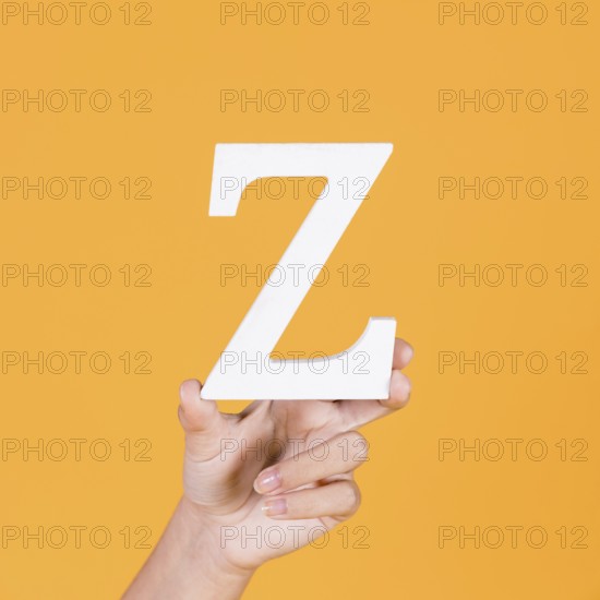 Close up hand holding up alphabet z
