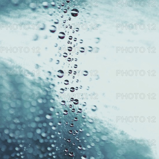 Abstract water drops turquoise glass background. High resolution photo