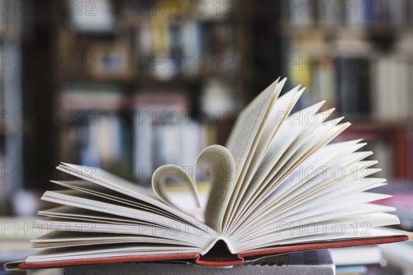 Book with its pages shaping as heart