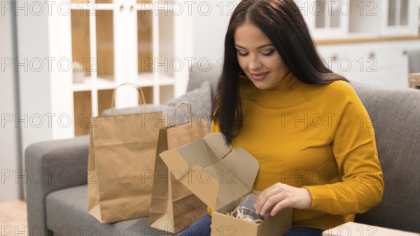 Woman unboxing her new purchase