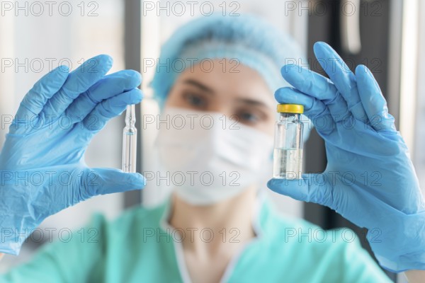 Nurse holding ampoule