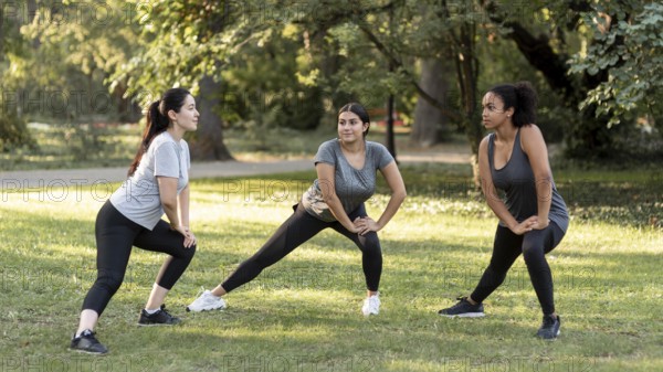 Three female friends training park