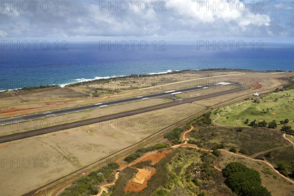 Aerial view over the airport of Lihue, Kauai, Hawaii, USA with view over the runway to the