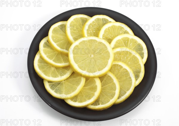 Um, lemon (Citrus limon), lemon tree lozenge family, YELLOW LEMON Citrus lemon ON A PLATE
