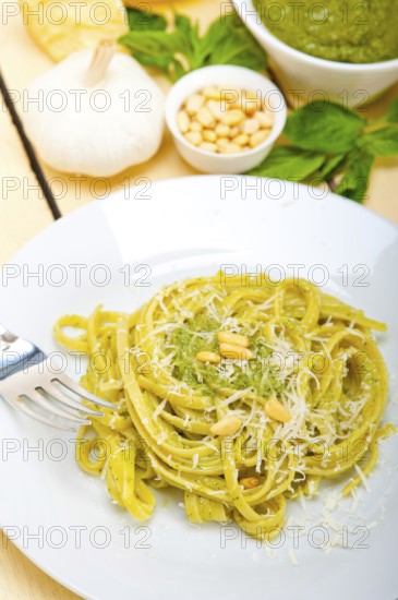 Italian traditional basil pesto pasta ingredients parmesan cheese pine nuts extra virgin olive oil