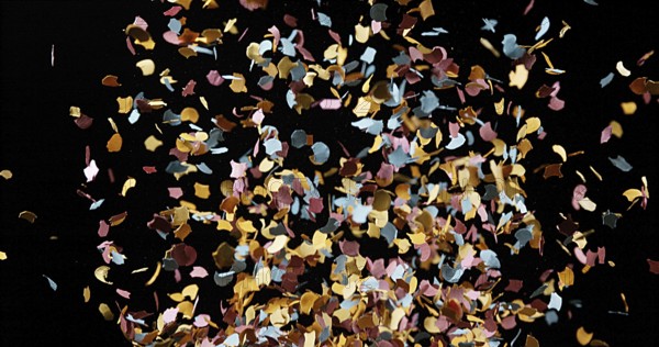 Confettis Falling against Black Background