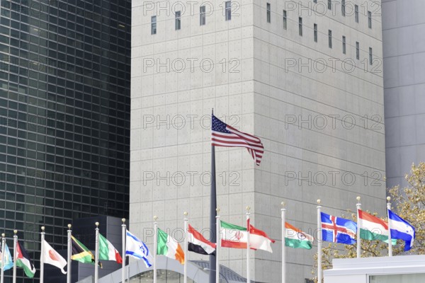 UN Headquarters, East River, Manhattan, row of international flags against the background of a