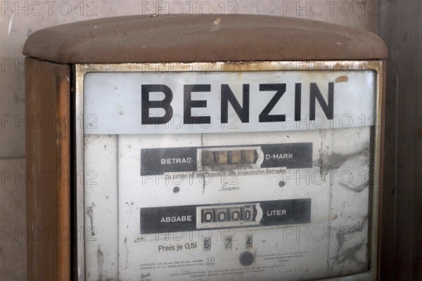 Old rusty german petrol pump, the lettering is in german, Benzin means petrol or gasoline, Munich,
