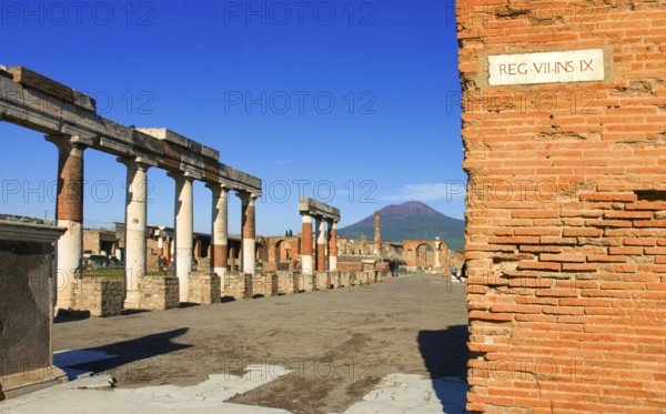 Ruins of Pompei or Pompeii with Vesuv in background with street sign in Latin in The Metropolitan