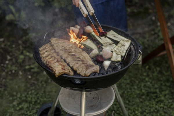 Man barbecuing in the garden
