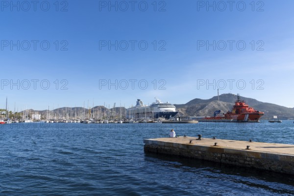 Cartagena, Spain - 29 December, 2021: the Cartagena marina and port with many boats and a cruise