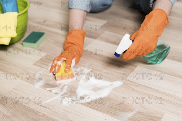 high angle woman cleaning floors