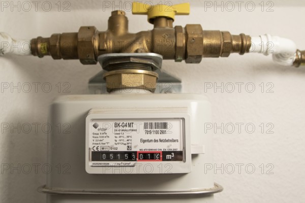 Symbolic image of energy costs in the household, natural gas, analogue gas meter in a flat,
