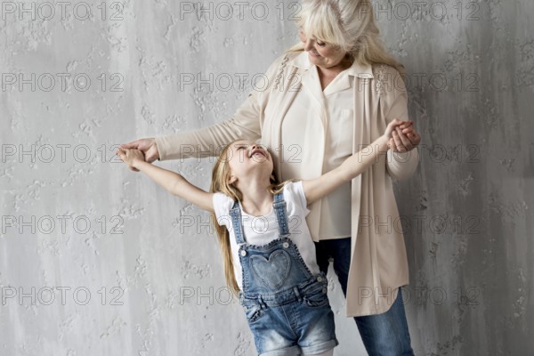 Grandma with little girl having fun