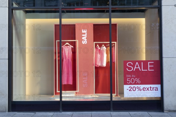 Symbolic image, shop window with sale lettering for the summer sale in a clothing shop in a