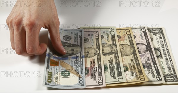 Hands of Woman and Dollar Banknotes