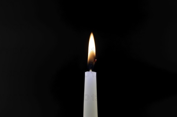 Close-up of a candle flame against a black background