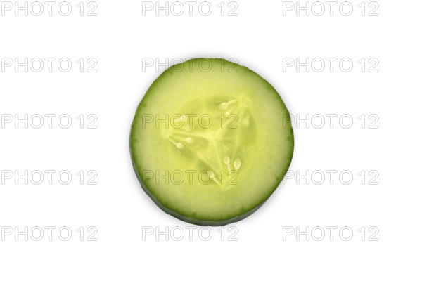 Close-up of a single cucumber slice, Freshly sliced cucumber close-up on a white background