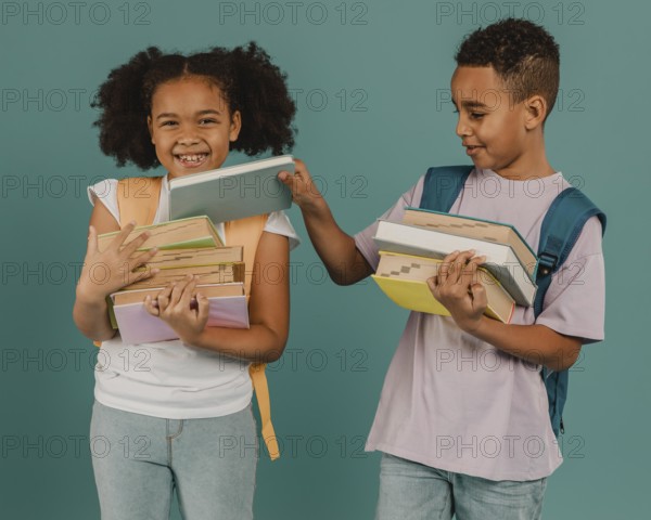 Boy helping his friend with books