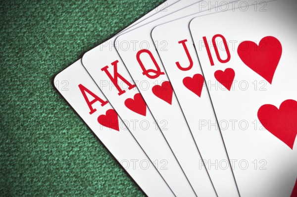 Royal Flush poker card sequence on a green table