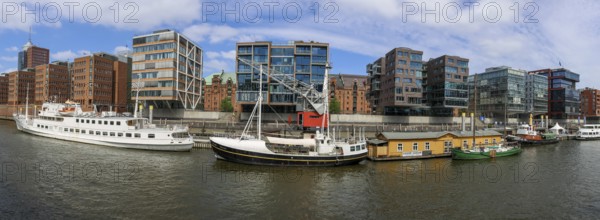 Panoramic photo of Sandtorhafen, traditional ship harbour and modern buildings in Hafencity,
