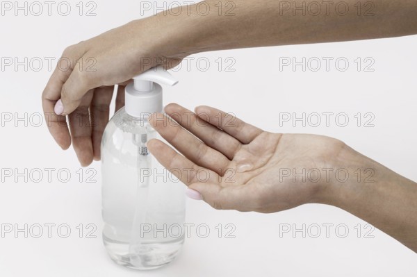 High angle person using liquid soap