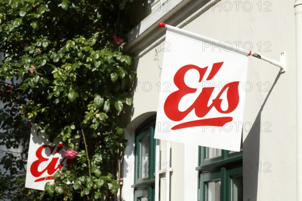Red sign ice cream in front of an ice cream parlour, white background, Germany, Europe