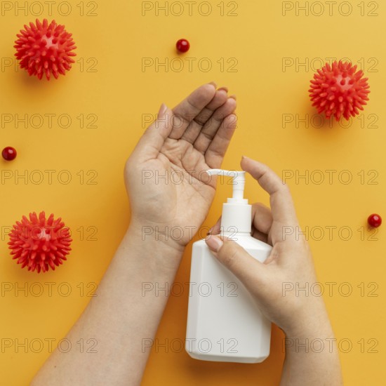 Flat lay hands using liquid soap with viruses