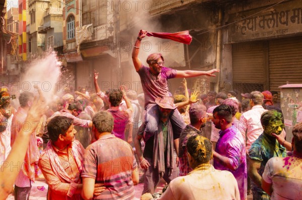 Holi Festival of Colors in the streets of Mathura, India, Asia