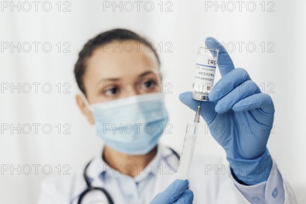 Close up woman with syringe serum