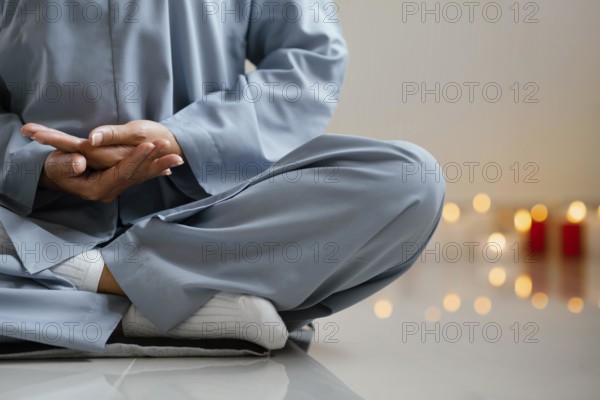 Front view woman meditating candles