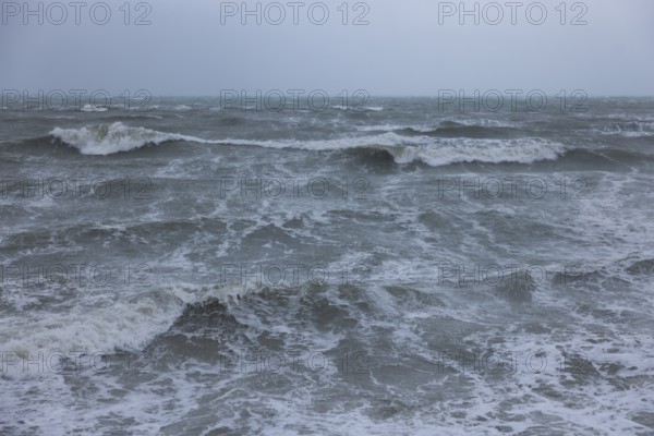 Stormy sea, foaming sea in storm with high waves on the English Channel, Portbail, Cotentin,