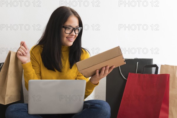 Woman holding new packages from cyber monday sales with copy space